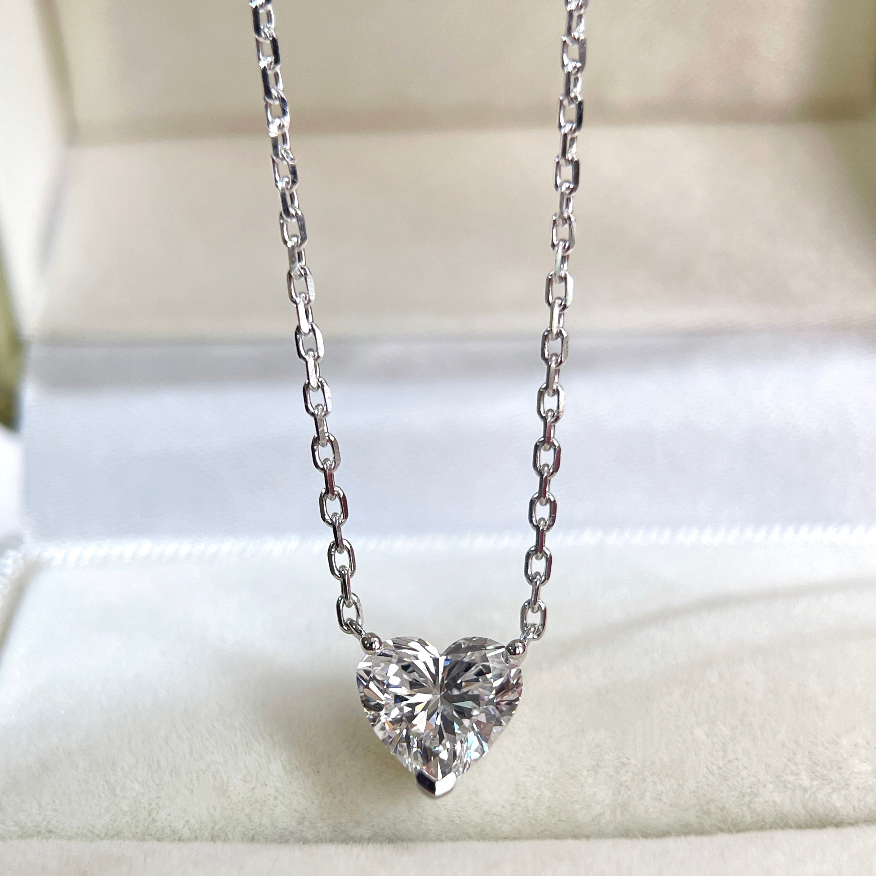 Front presentation of a 1.51 carat heart-shaped lab grown diamond necklace in 18K white gold.