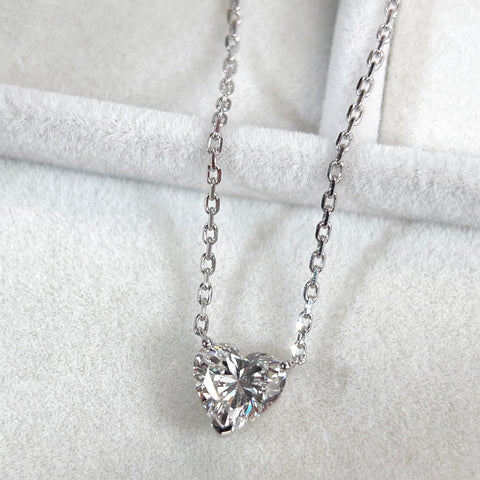 Jewelry display detail of a 1.51 carat heart-shaped lab grown diamond necklace in 18K white gold.
