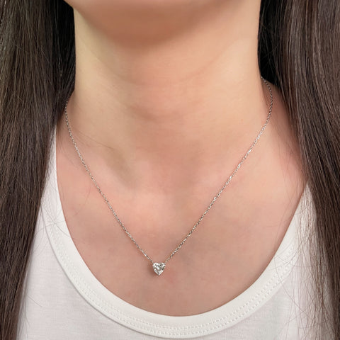 Model wearing a 1.51 carat heart-shaped lab grown diamond necklace in 18K white gold.