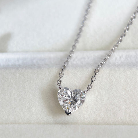 Diamond detail of a 1.51 carat heart-shaped lab grown diamond necklace in 18K white gold.