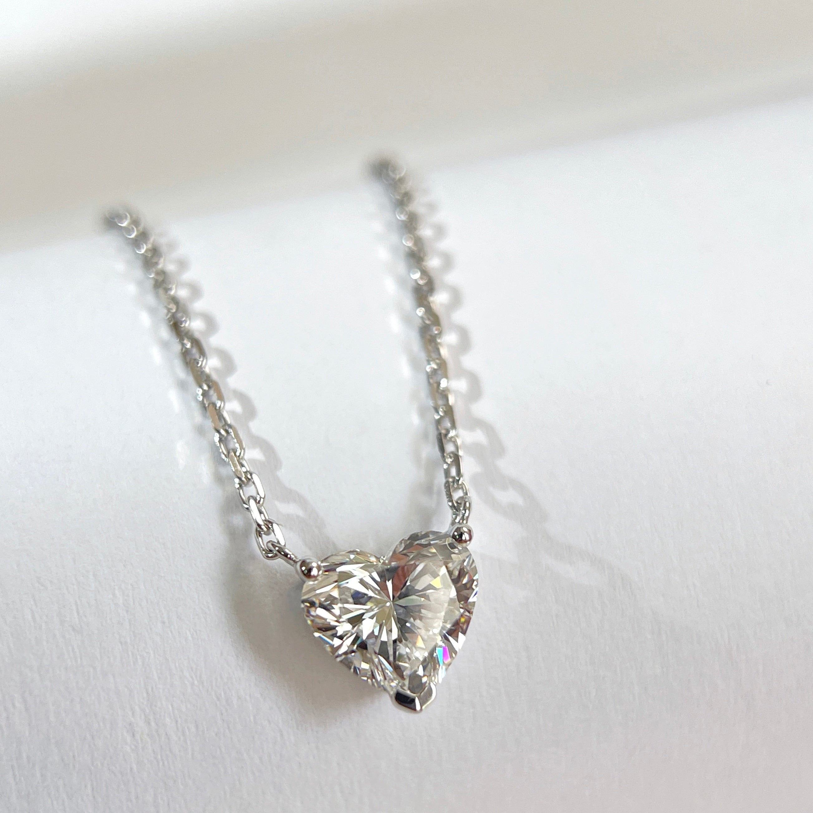 Close-up of a 1.51 carat heart-shaped lab grown diamond necklace in 18K white gold.
