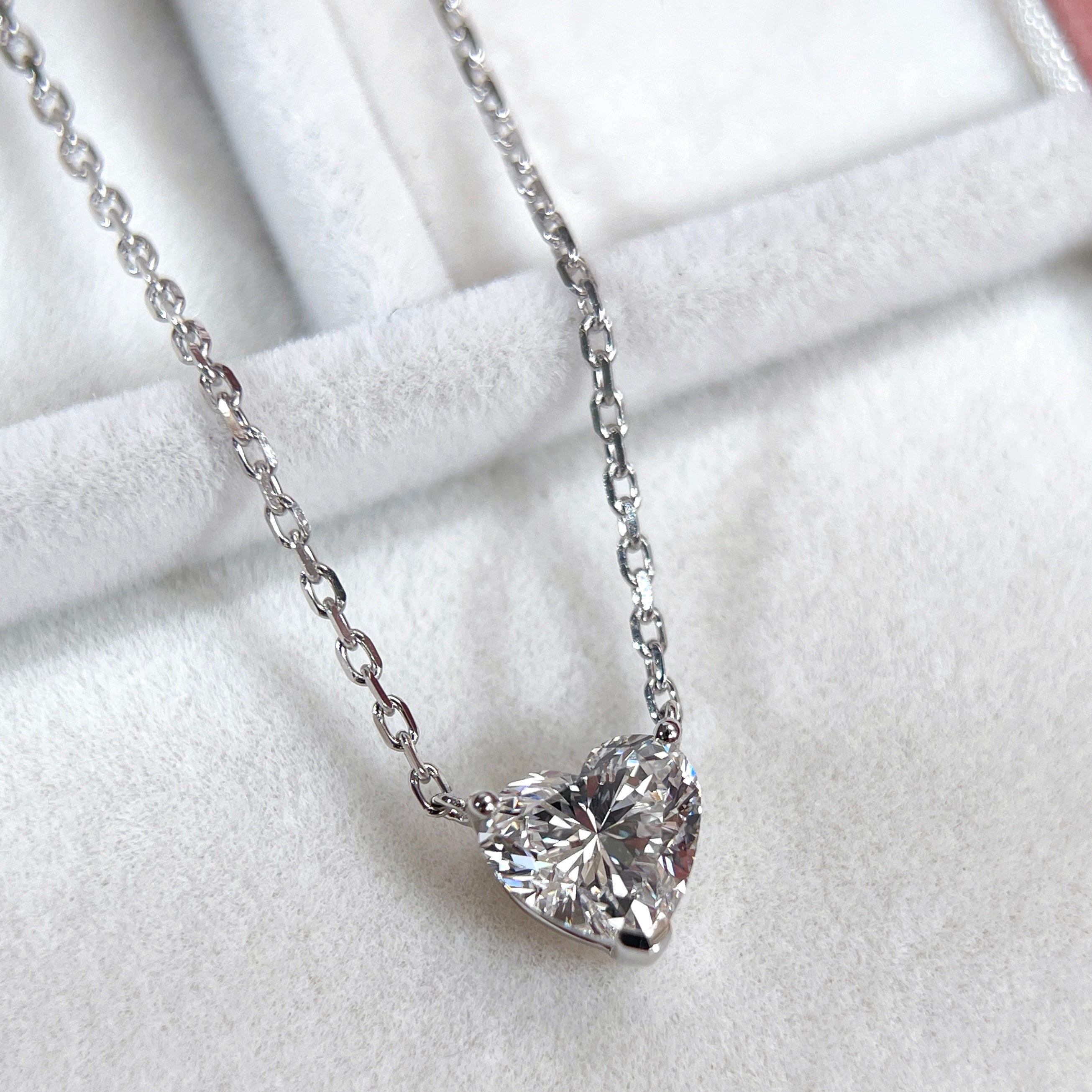 Angled view of a 1.51 carat heart-shaped lab grown diamond necklace in 18K white gold.