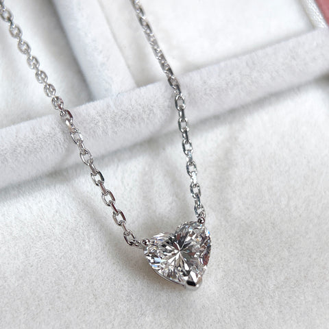 Angled view of a 1.51 carat heart-shaped lab grown diamond necklace in 18K white gold.