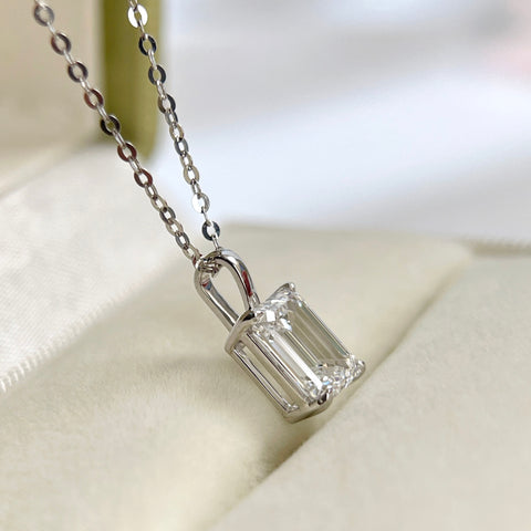 Side view showing the four-prong basket and bail of an emerald-cut lab grown diamond pendant