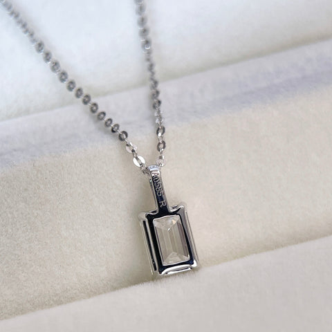 Back view showing the open basket and bail of an emerald-cut lab grown diamond 14K white gold pendant