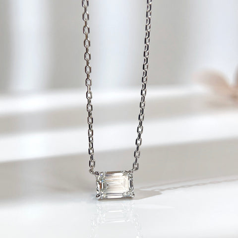 Front view of a 1.5 ct emerald-cut lab grown diamond necklace in an 18K white gold four-prong setting