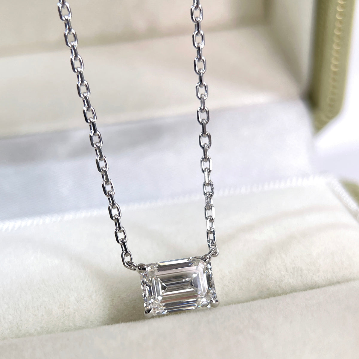 Emerald-cut lab grown diamond 18K white gold necklace displayed in a jewelry box