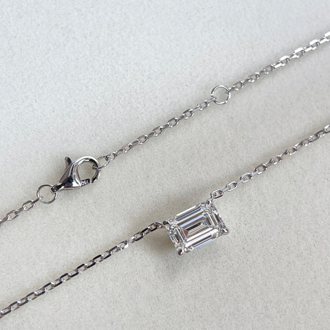 Clasp and adjustment ring detail on an emerald-cut lab grown diamond 18K white gold necklace