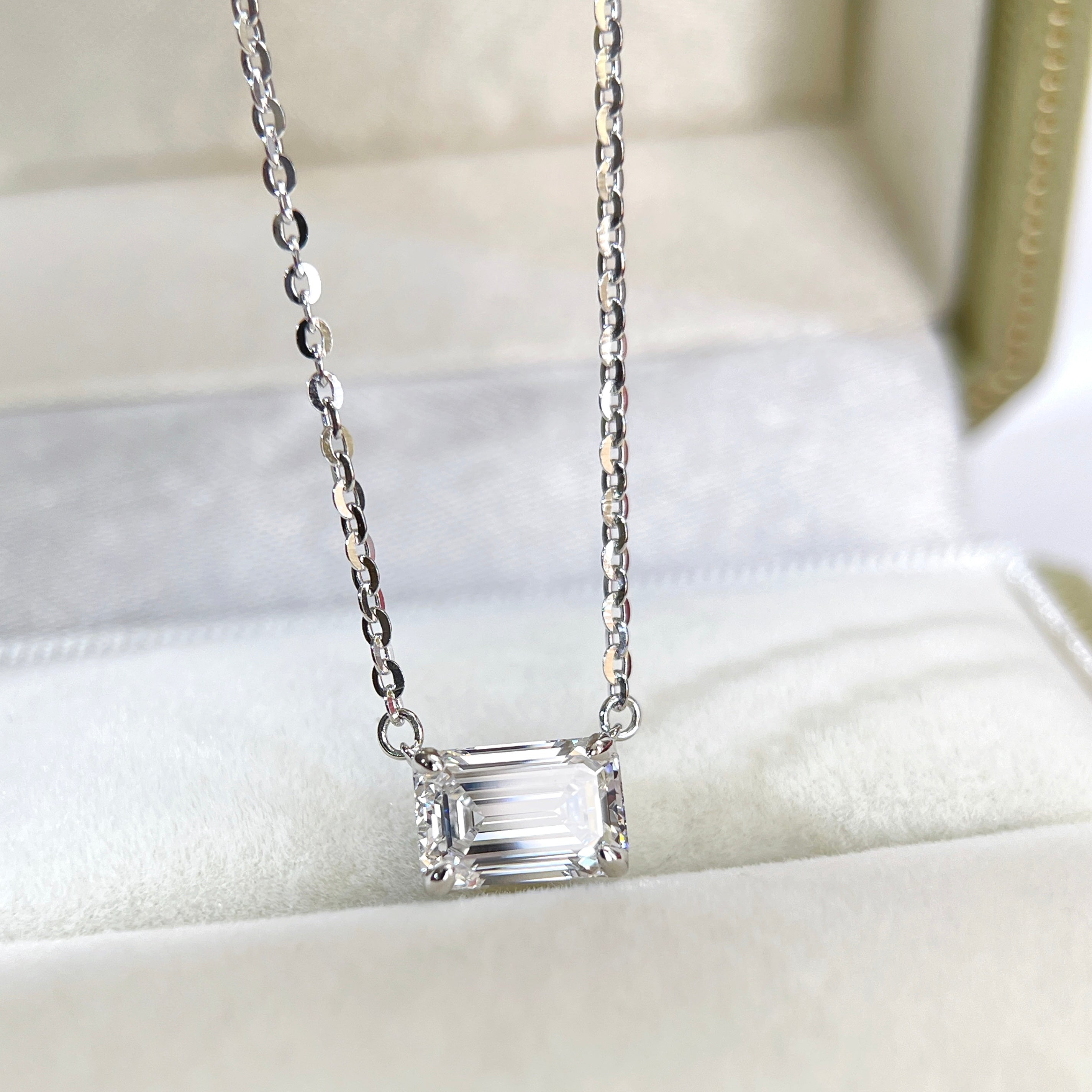Front view of a 1.5 ct emerald-cut lab grown diamond solitaire necklace in sterling silver