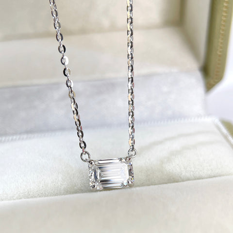 Front view of a 1.5 ct emerald-cut lab grown diamond solitaire necklace in sterling silver