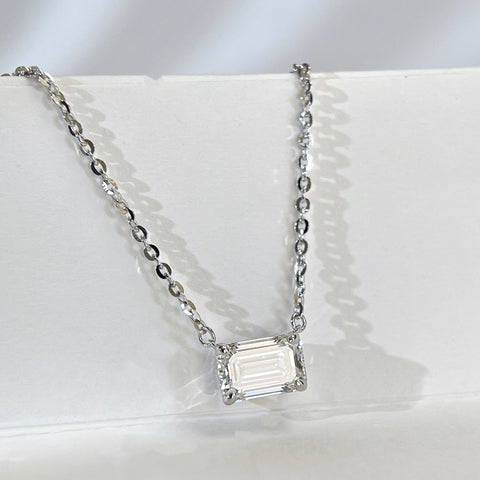 Close display view of a 1.5 ct emerald-cut lab grown diamond sterling silver necklace