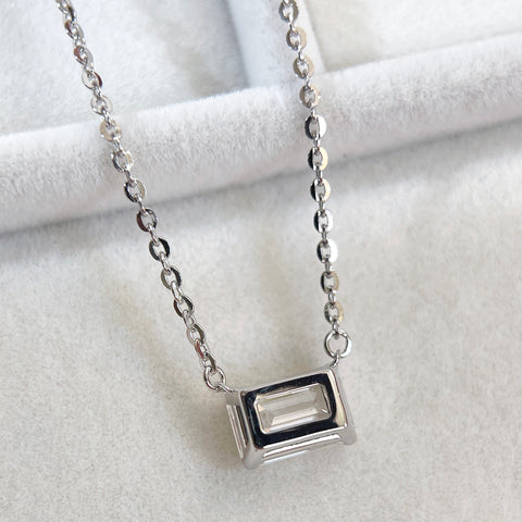 Back view of the open basket setting on an emerald-cut lab grown diamond sterling silver necklace