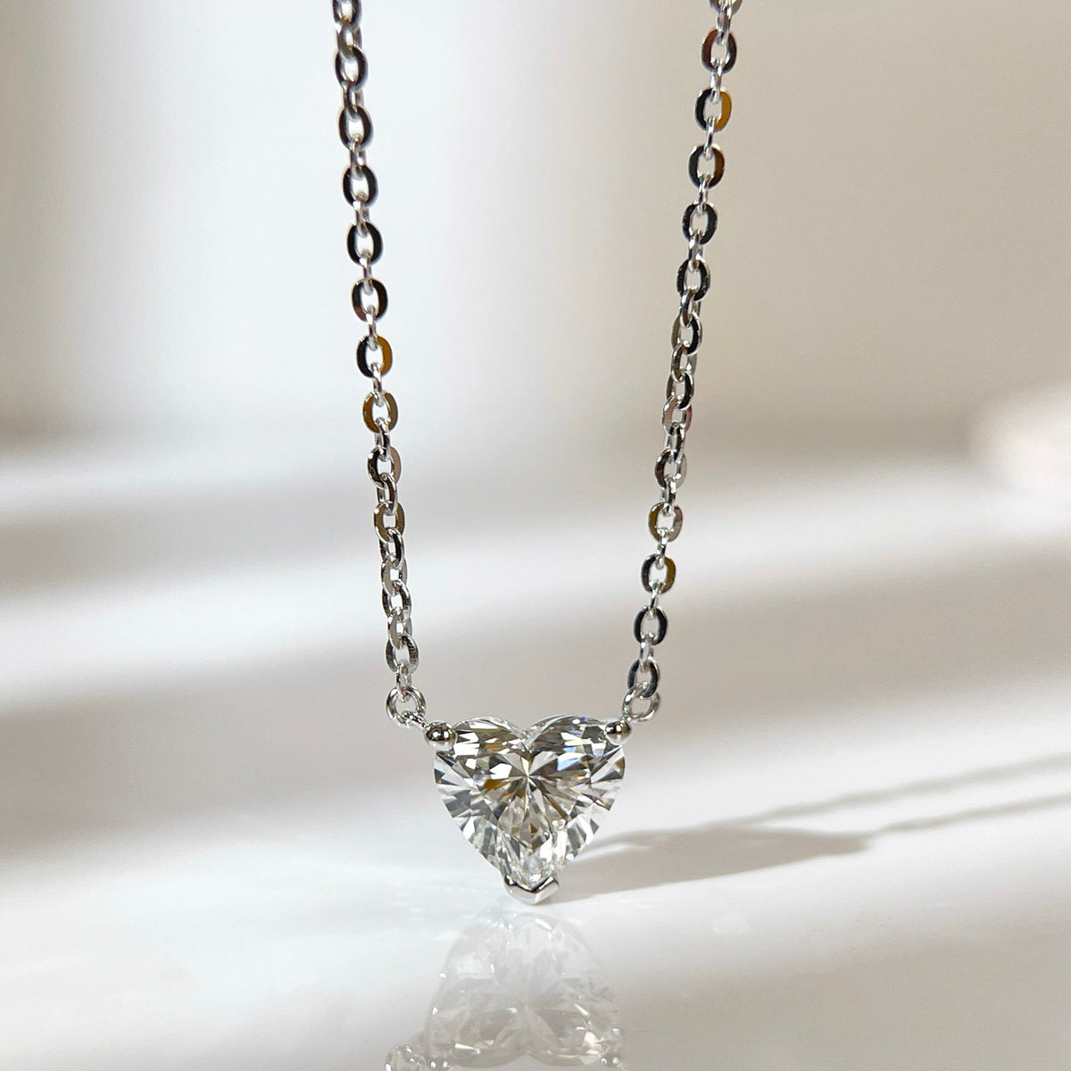 Front presentation of a 1.5 carat heart-shaped lab grown diamond necklace in S925 sterling silver.