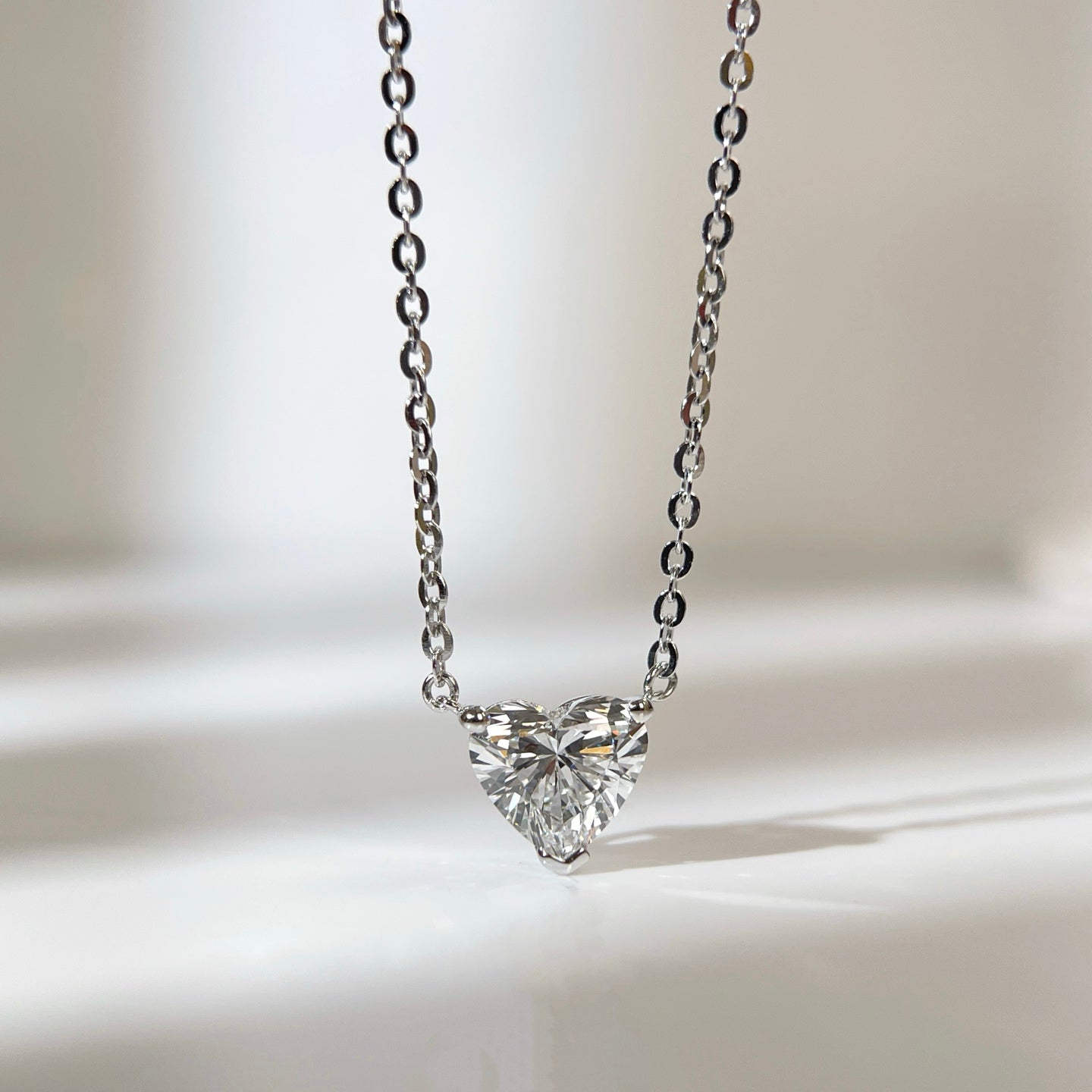 Front view of a 1.5 carat heart-shaped lab grown diamond necklace in S925 sterling silver.