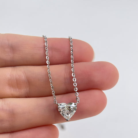 Close-up displayed on a hand: a 1.5 carat heart-shaped lab grown diamond necklace in S925 sterling silver.