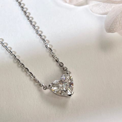 Angled view of a 1.5 carat heart-shaped lab grown diamond necklace in S925 sterling silver.