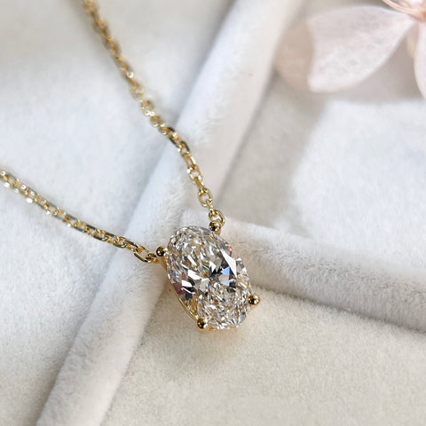 Front angled view of a 1.5 carat oval lab-grown diamond necklace