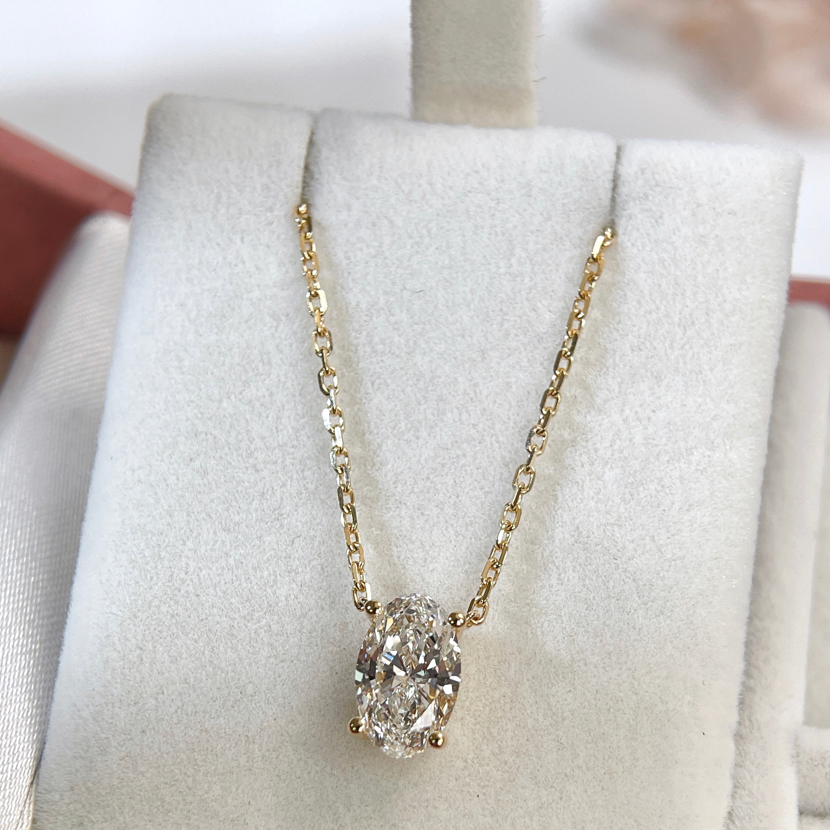 Full jewelry box display of a 1.5 carat oval lab-grown diamond necklace