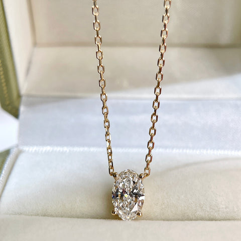 Full-length view of an 18K yellow gold oval lab-grown diamond necklace