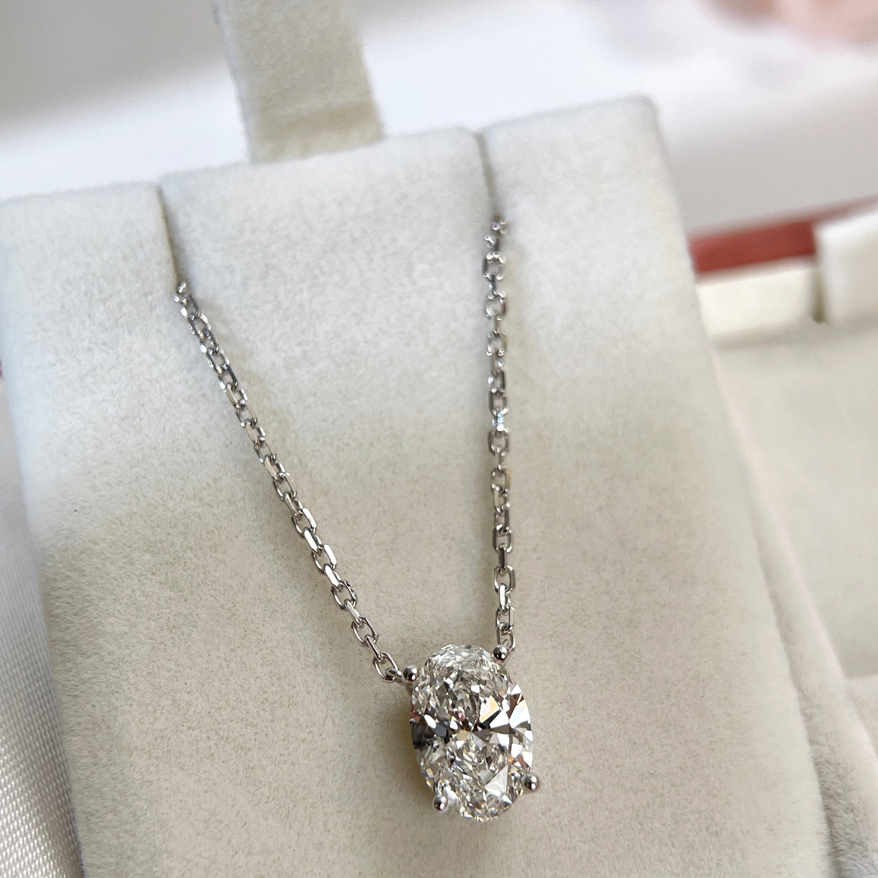 Full necklace display of a 1.58 carat oval lab grown diamond necklace in 18K white gold.