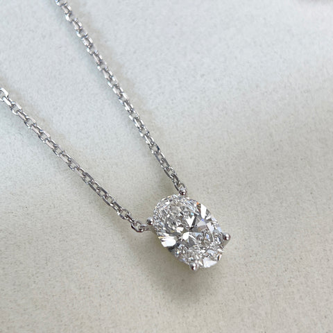 Diamond detail of a 1.58 carat oval lab grown diamond necklace in 18K white gold.