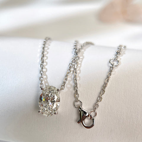 Chain and clasp detail of a 1.58 carat oval lab grown diamond necklace in 18K white gold.
