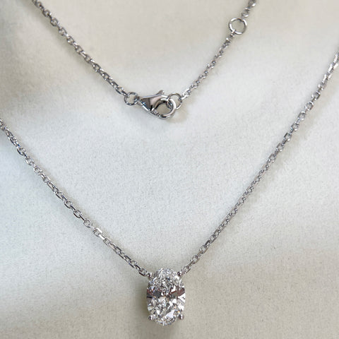 Full necklace and clasp display of a 1.58 carat oval lab grown diamond necklace in 18K white gold.