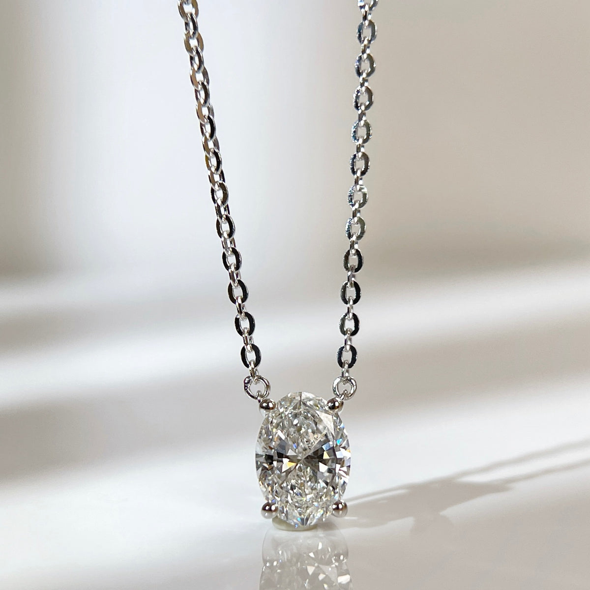 Front presentation of a 1.5 carat oval lab grown diamond necklace in S925 sterling silver.