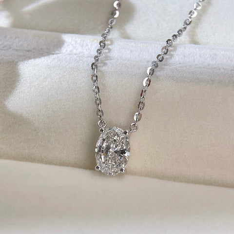Jewelry display of a 1.5 carat oval lab grown diamond necklace in S925 sterling silver.