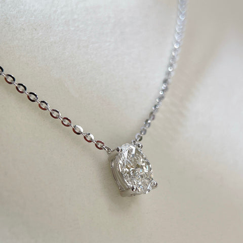 Back view showing the four-prong setting of a 1.5 carat oval lab grown diamond necklace in S925 sterling silver.