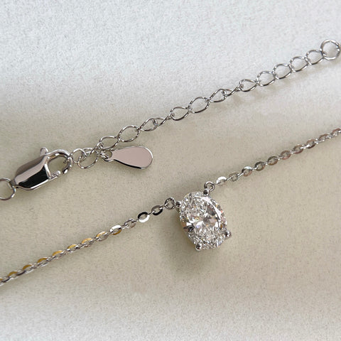 Adjustable extender and clasp detail of a 1.5 carat oval lab grown diamond necklace in S925 sterling silver.
