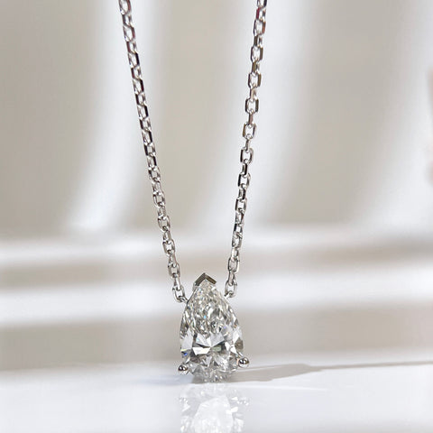 Front presentation of a 1.5 carat pear lab grown diamond necklace in 18K white gold.