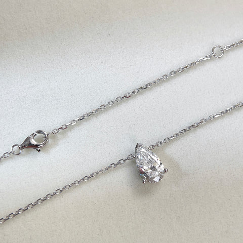 Chain and clasp detail of a 1.5 carat pear lab grown diamond necklace in 18K white gold.