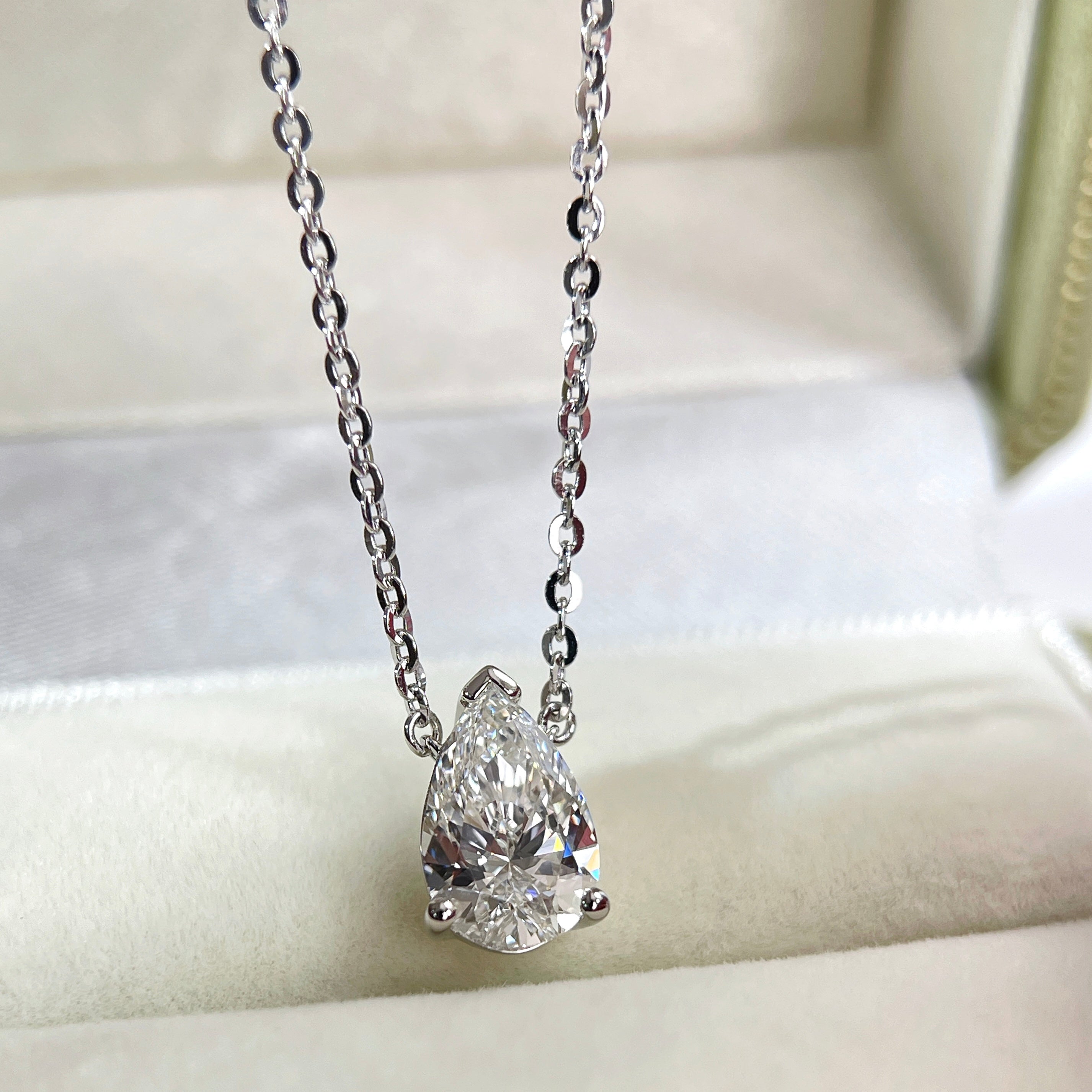 Front presentation of a 1.5 carat pear lab grown diamond necklace in S925 sterling silver.