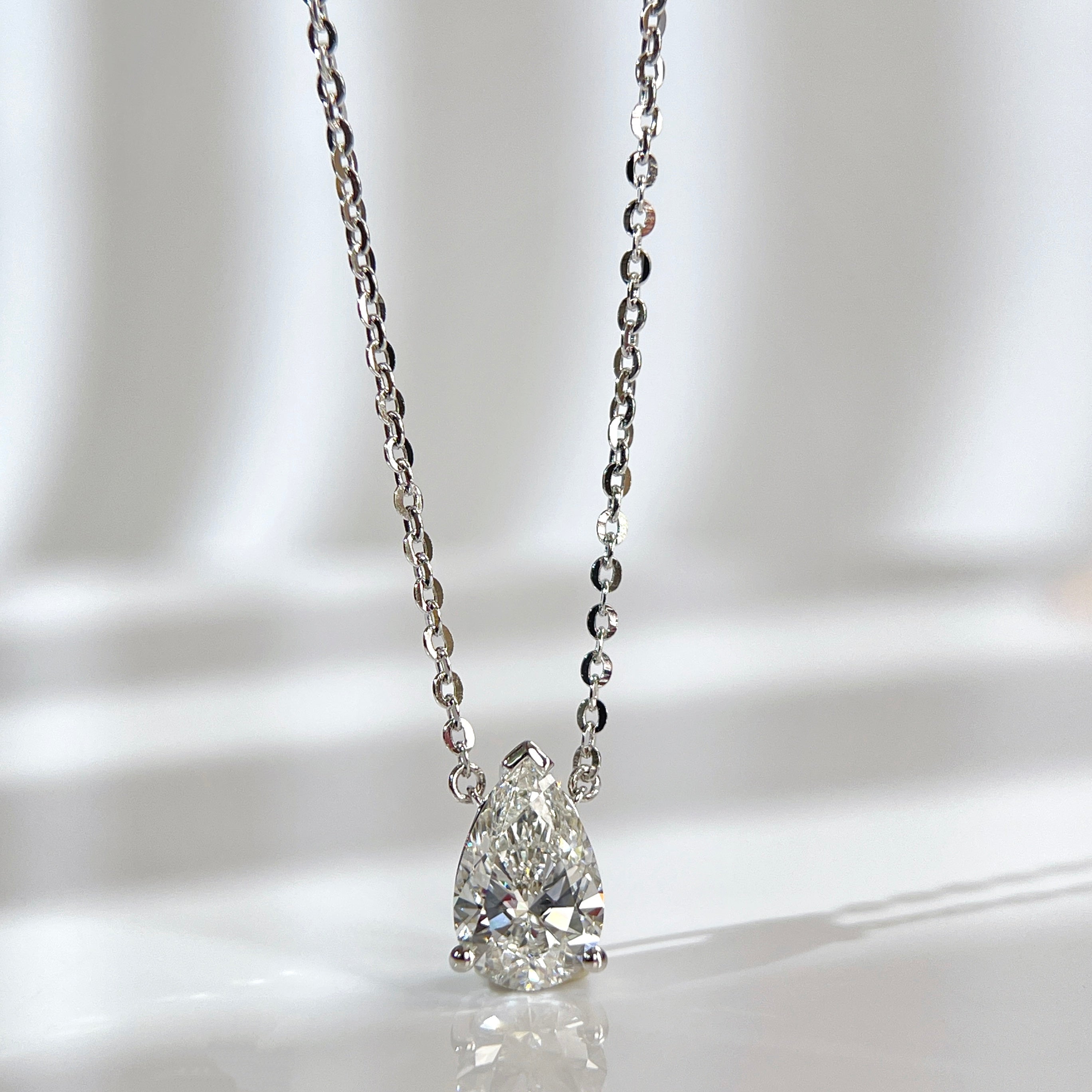 Front view of a 1.5 carat pear lab grown diamond necklace in S925 sterling silver.