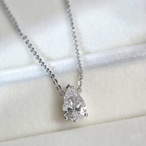 Close-up of a 1.5 carat pear lab grown diamond necklace in S925 sterling silver.