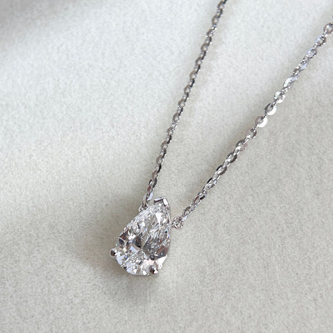 Angled front view of a 1.5 carat pear lab grown diamond necklace in S925 sterling silver.
