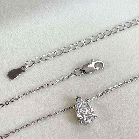 Adjustable extender and clasp detail of a 1.5 carat pear lab grown diamond necklace in S925 sterling silver.