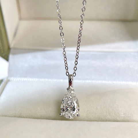 Front presentation of a 1.5 carat pear lab grown diamond pendant in 14K white gold styled on a chain; chain not included.
