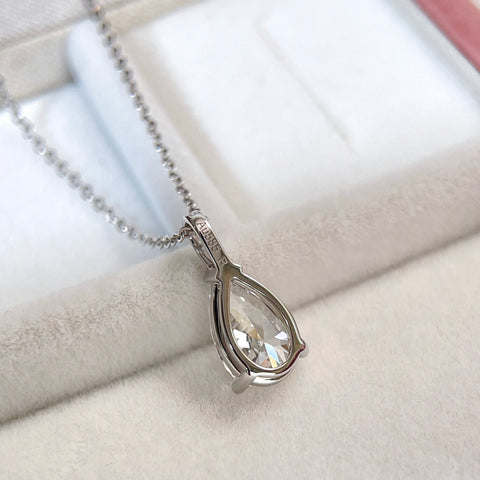 Back view showing the setting of a 1.5 carat pear lab grown diamond pendant in 14K white gold styled on a chain; chain not included.
