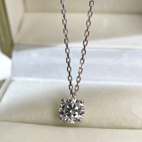 Angled view of a 1.5 carat round lab grown diamond fixed pendant necklace in 18K white gold.