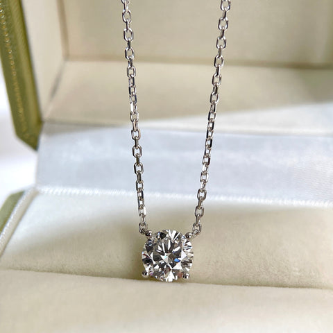 Front presentation of a 1.5 carat round lab grown diamond necklace in 18K white gold.