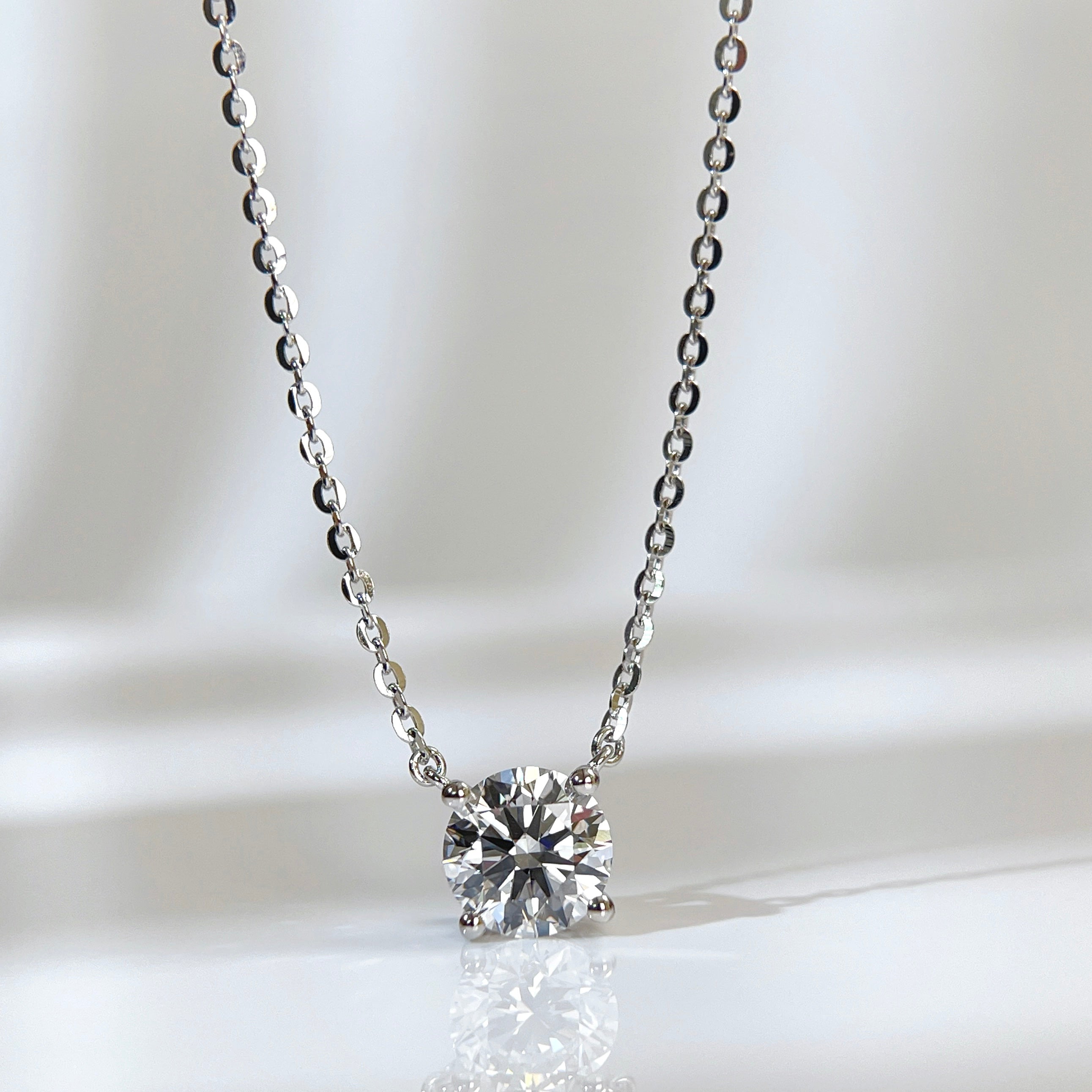 Front presentation of a 1.5 carat round lab grown diamond necklace in S925 sterling silver.