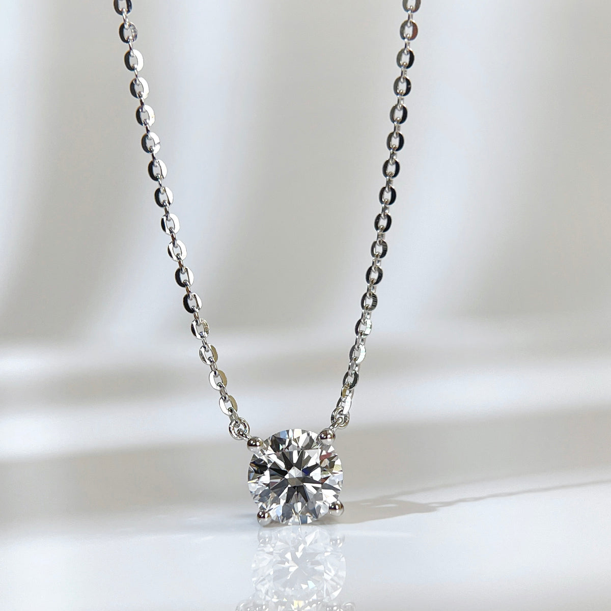 Front presentation of a 1.5 carat round lab grown diamond necklace in S925 sterling silver.