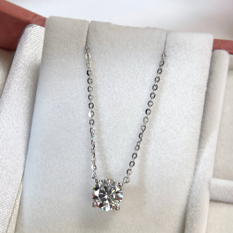 Jewelry display of a 1.5 carat round lab grown diamond necklace in S925 sterling silver.