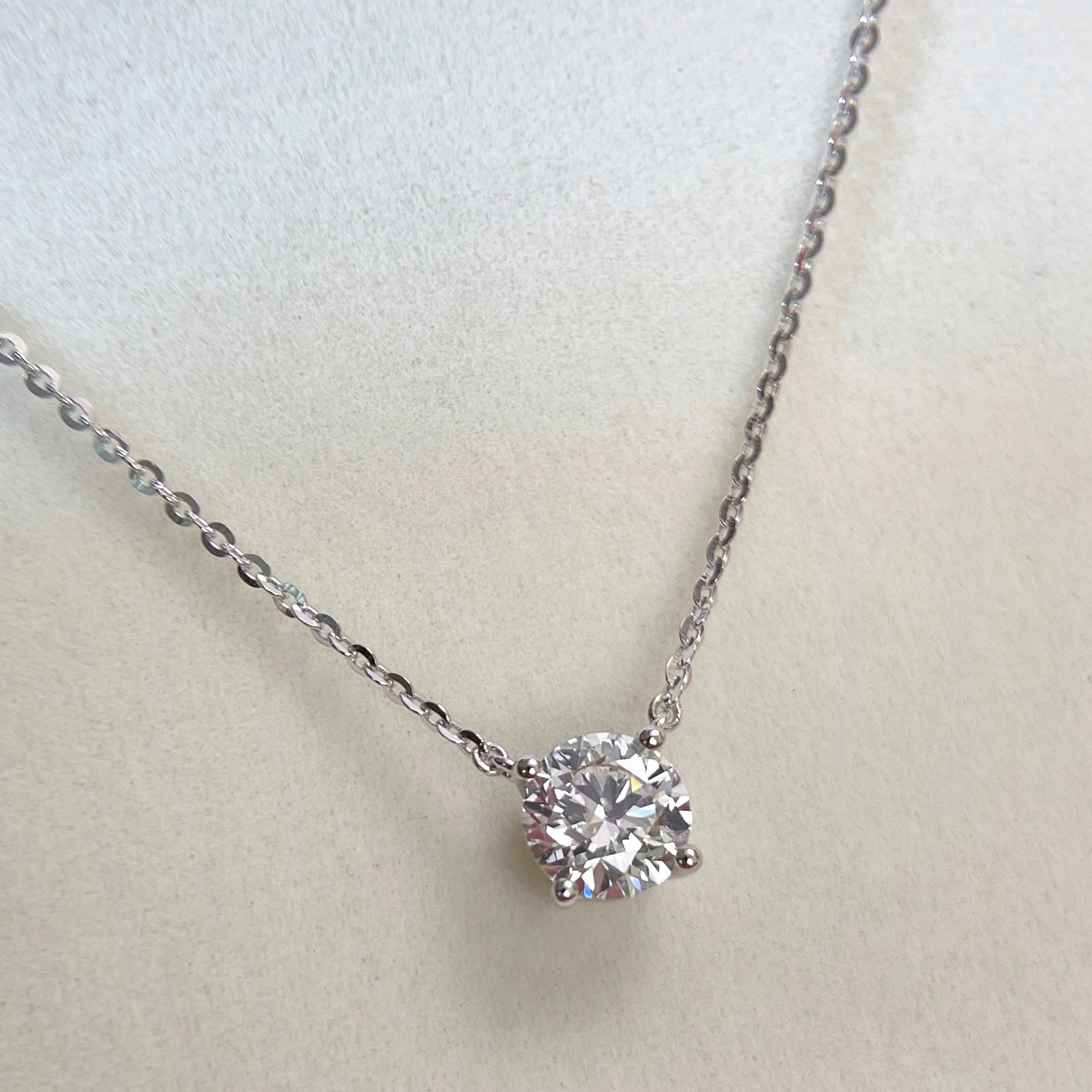 Close-up of a 1.5 carat round lab grown diamond necklace in S925 sterling silver.