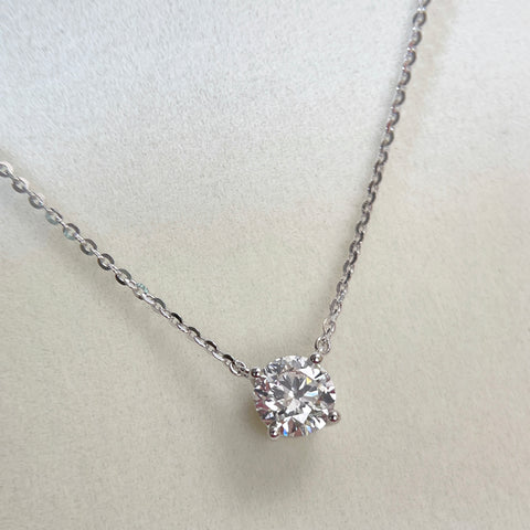 Close-up of a 1.5 carat round lab grown diamond necklace in S925 sterling silver.