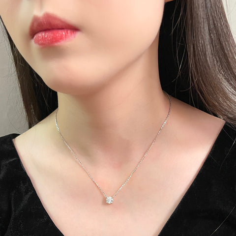 Model wearing a 1.5 carat round lab grown diamond necklace in S925 sterling silver.