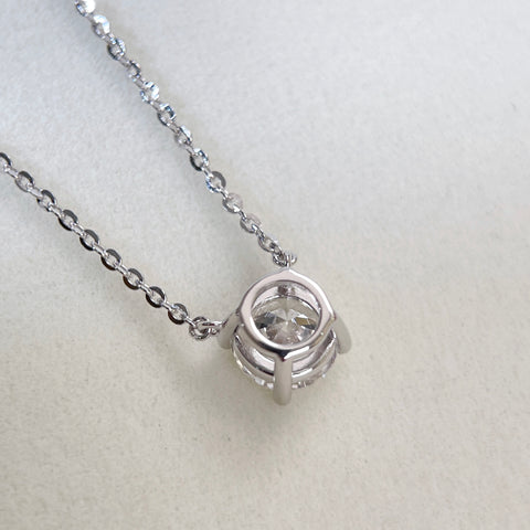 Back view showing the four-prong setting of a 1.5 carat round lab grown diamond necklace in S925 sterling silver.
