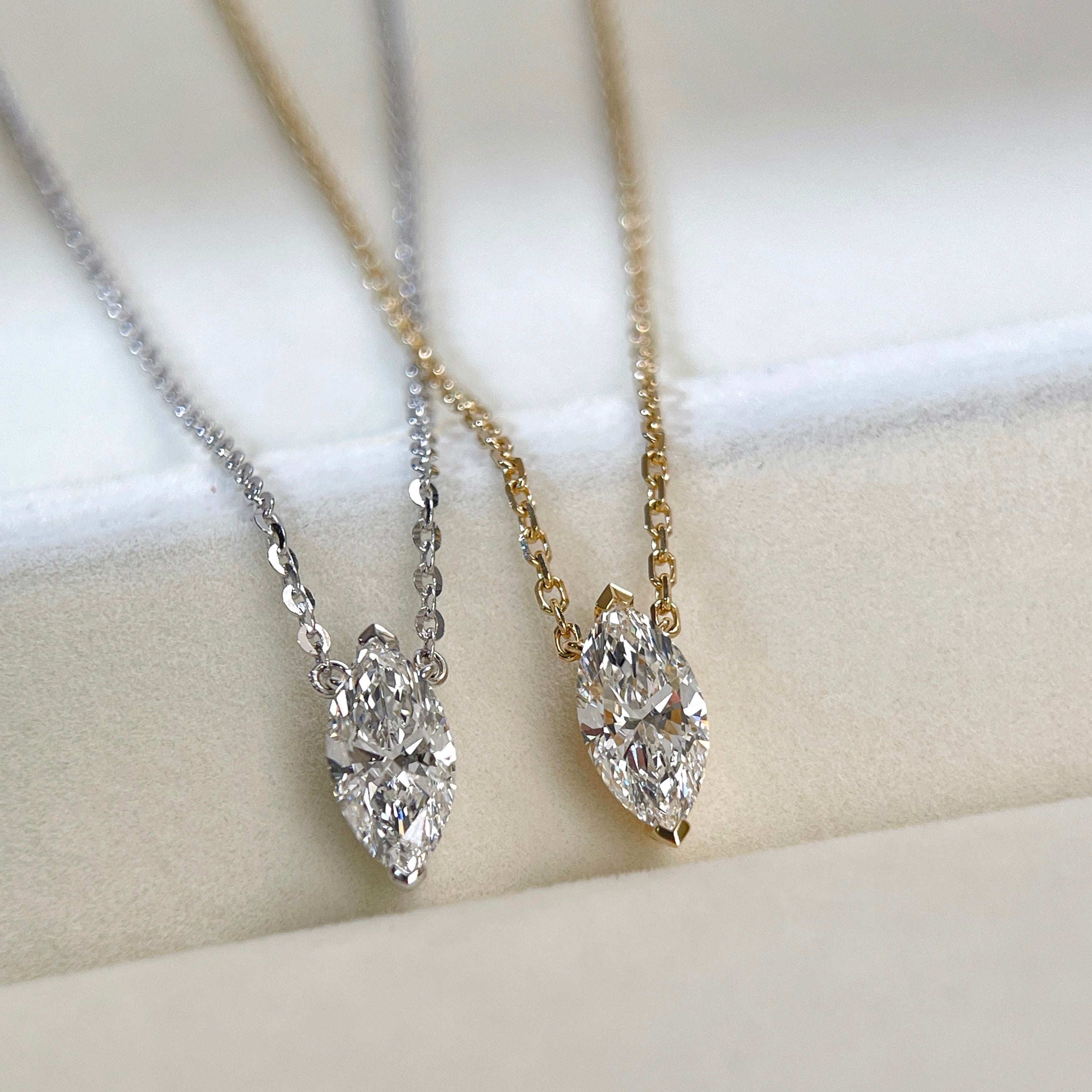 18K yellow gold and silver-tone marquise lab grown diamond necklace comparison.